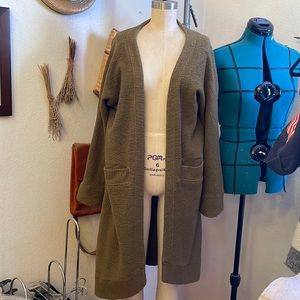 Out from under green cardigan